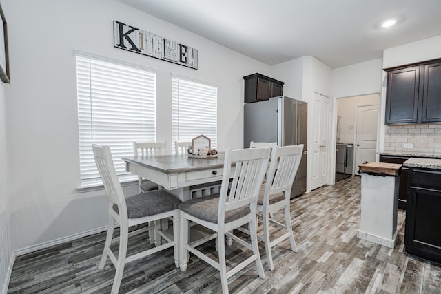 273 Pitt Cir, Fate, TX 75189 - dining room with light wood-style flooring and baseboards