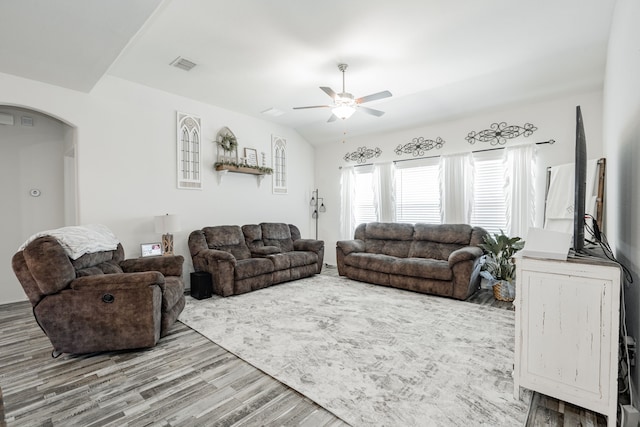 273 Pitt Cir, Fate, TX 75189 - living area with arched walkways, wood finished floors, and a ceiling fan