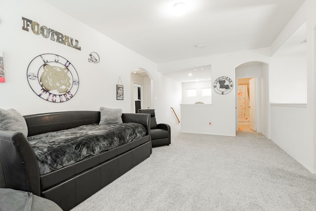 273 Pitt Cir, Fate, TX 75189 - carpeted living area featuring arched walkways and baseboards