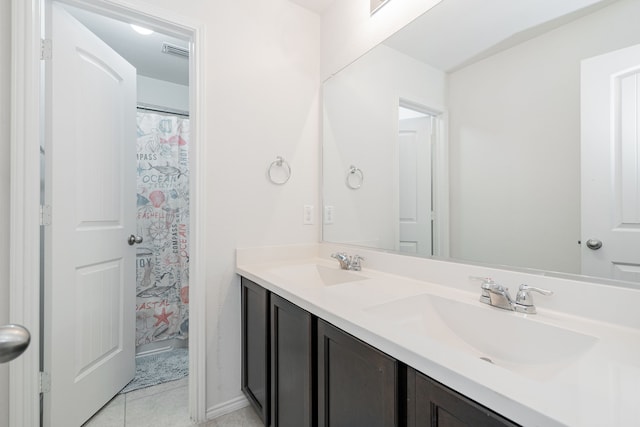 273 Pitt Cir, Fate, TX 75189 - bathroom featuring double vanity, tile patterned floors, and a shower with shower curtain