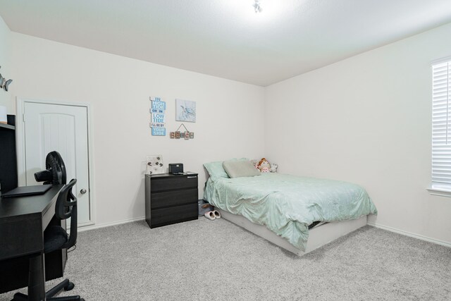 273 Pitt Cir, Fate, TX 75189 - bedroom featuring carpet flooring, a desk, and baseboards