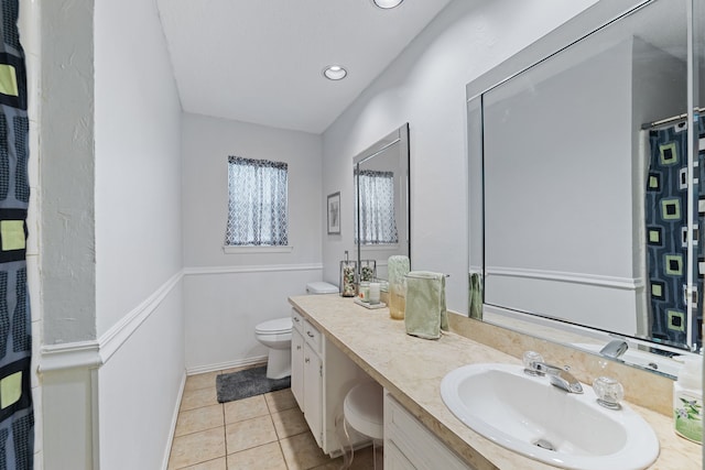 5501 Wood View St, North Richland Hills, TX 76180 - full bathroom with toilet, vanity, tile patterned flooring, baseboards, and recessed lighting
