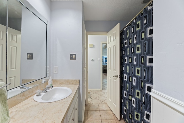 5501 Wood View St, North Richland Hills, TX 76180 - bathroom featuring tile patterned floors and vanity