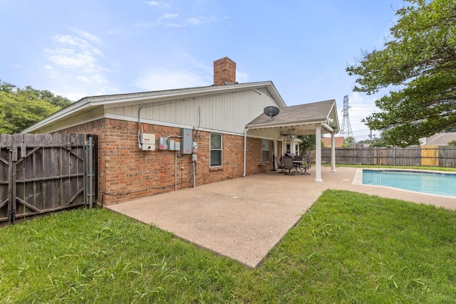 5501 Wood View St, North Richland Hills, TX 76180 - back of property featuring a chimney, a patio, and brick siding