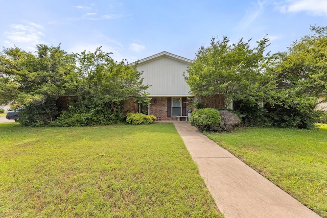 5501 Wood View St, North Richland Hills, TX 76180 - view of front of property with a front lawn and brick siding