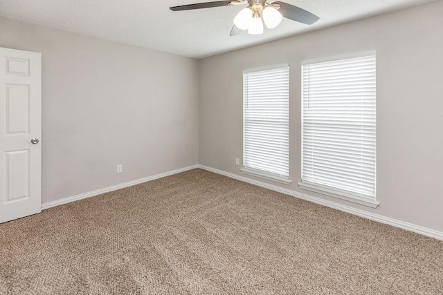 2502 Lake Valley Dr, Garland, TX 75040 - empty room with carpet, ceiling fan, and baseboards