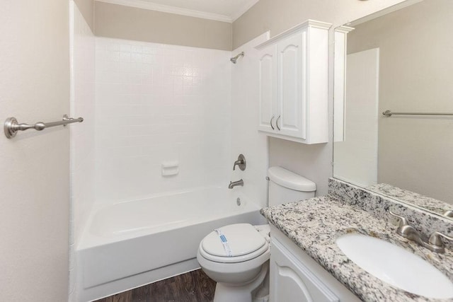 2502 Lake Valley Dr, Garland, TX 75040 - full bathroom featuring crown molding, vanity, toilet, tub / shower combination, and wood finished floors