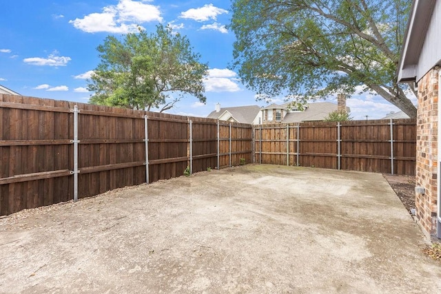 2502 Lake Valley Dr, Garland, TX 75040 - fenced backyard with a patio area