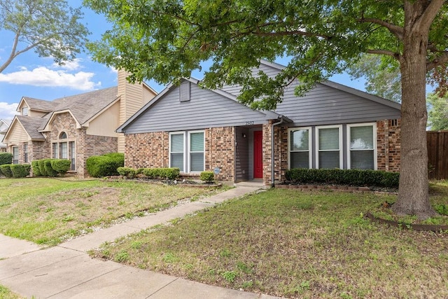2502 Lake Valley Dr, Garland, TX 75040 - ranch-style home with brick siding, a front lawn, and a chimney