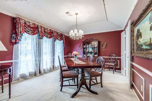 6921 Vineridge Dr, Dallas, TX 75248 - dining room featuring a chandelier, light colored carpet, and vaulted ceiling