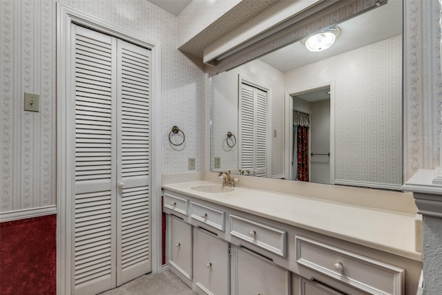 6921 Vineridge Dr, Dallas, TX 75248 - bathroom with a closet, wallpapered walls, and vanity