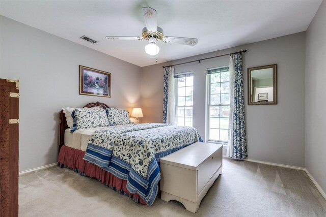 6921 Vineridge Dr, Dallas, TX 75248 - bedroom featuring light carpet, baseboards, and ceiling fan