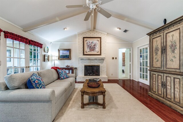 6921 Vineridge Dr, Dallas, TX 75248 - living room with wood finished floors, ceiling fan, a fireplace, ornamental molding, and baseboards