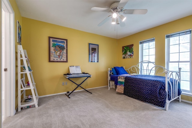 6921 Vineridge Dr, Dallas, TX 75248 - bedroom with carpet flooring, multiple windows, baseboards, and ceiling fan