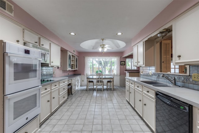 6921 Vineridge Dr, Dallas, TX 75248 - kitchen with black appliances, a sink, tasteful backsplash, white cabinets, and recessed lighting