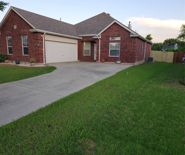 4026 Carrington Dr, Garland, TX 75043 - view of front of home with brick siding, an attached garage, concrete driveway, roof with shingles, and central AC unit