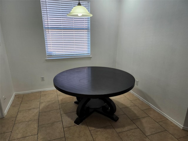 4026 Carrington Dr, Garland, TX 75043 - dining area featuring baseboards and tile patterned flooring