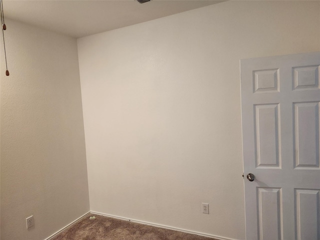 4026 Carrington Dr, Garland, TX 75043 - unfurnished room with dark colored carpet and baseboards