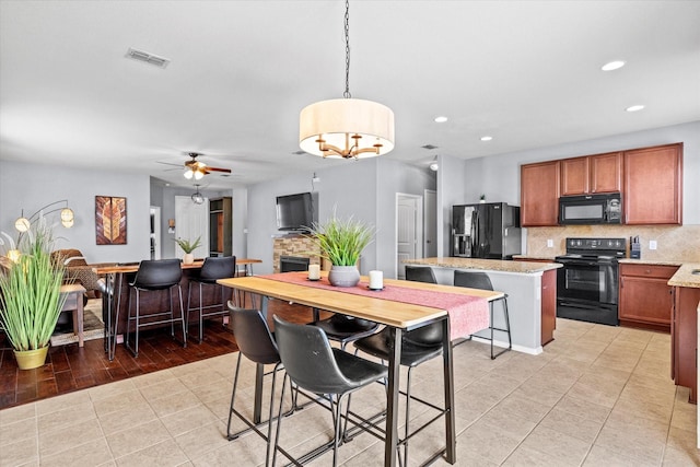 9129 Blackstone Dr, Providence Village, TX 76227 - dining room with light tile patterned flooring, recessed lighting, and ceiling fan