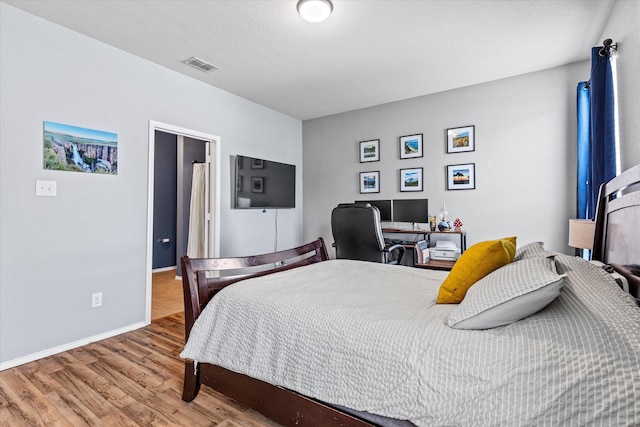 9129 Blackstone Dr, Providence Village, TX 76227 - bedroom with wood finished floors and baseboards