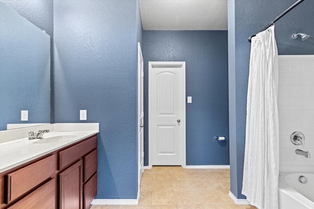 9129 Blackstone Dr, Providence Village, TX 76227 - bathroom with a textured wall, vanity, shower / bath combo, baseboards, and tile patterned floors