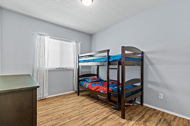 9129 Blackstone Dr, Providence Village, TX 76227 - bedroom featuring wood finished floors and baseboards