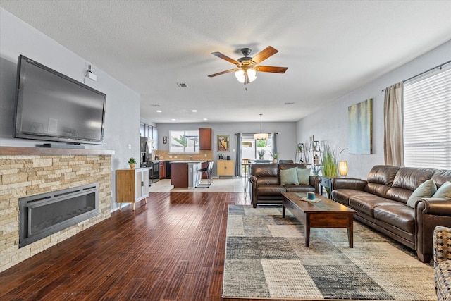 9129 Blackstone Dr, Providence Village, TX 76227 - living area featuring ceiling fan, hardwood / wood-style floors, a glass covered fireplace, and recessed lighting