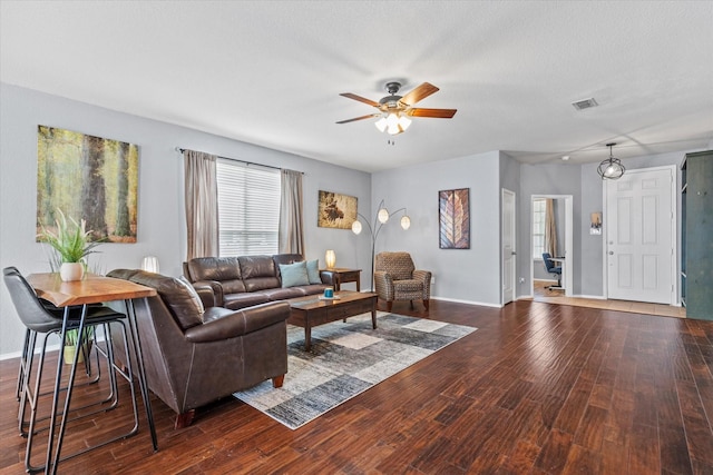 9129 Blackstone Dr, Providence Village, TX 76227 - living area featuring ceiling fan, dark wood-type flooring, healthy amount of natural light, and baseboards