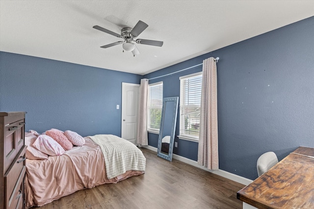 2132 Dewitt Ln, Providence Village, TX 76227 - bedroom with wood finished floors, baseboards, and ceiling fan