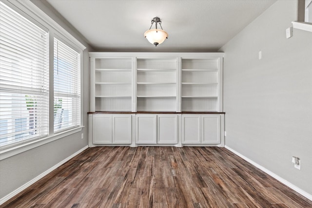 2132 Dewitt Ln, Providence Village, TX 76227 - unfurnished dining area with baseboards and dark wood finished floors