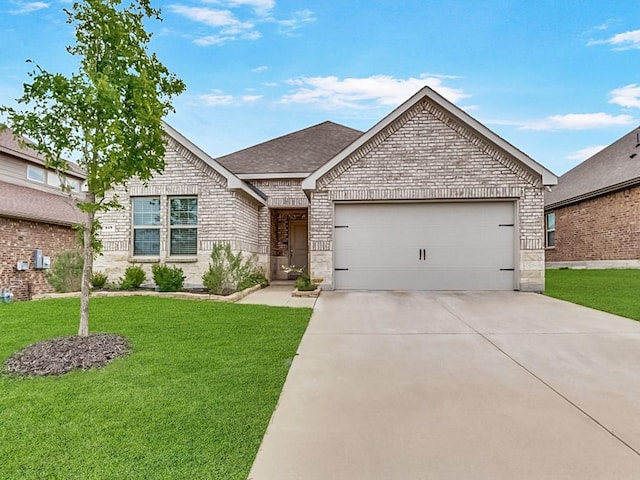 519 Stampede Ln, Princeton, TX 75407 - view of front of house featuring brick siding, a garage, a front yard, and driveway