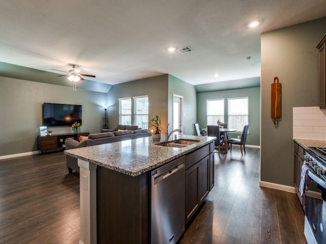 519 Stampede Ln, Princeton, TX 75407 - kitchen featuring stainless steel appliances, a sink, dark wood-style floors, light stone counters, and ceiling fan