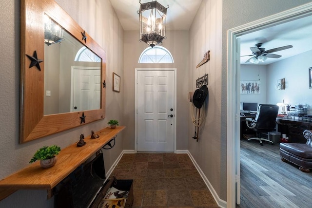 1551 Whiterock Dr, Midlothian, TX 76065 - foyer featuring baseboards, ceiling fan, and a chandelier