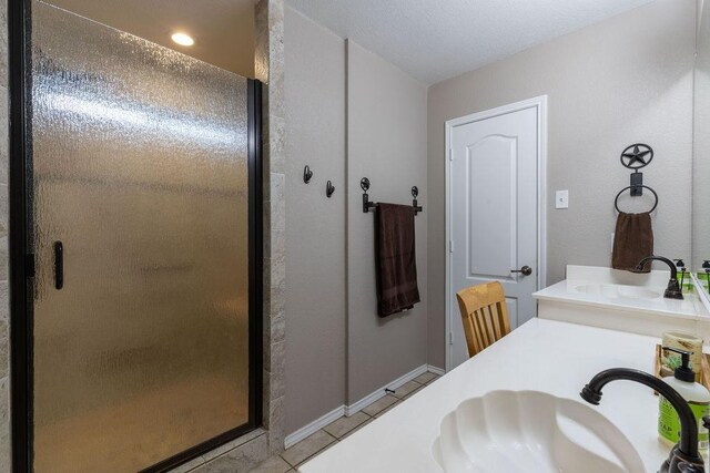 1551 Whiterock Dr, Midlothian, TX 76065 - full bath with a shower stall, tile patterned floors, double vanity, and baseboards