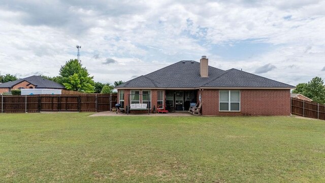 1551 Whiterock Dr, Midlothian, TX 76065 - rear view of property featuring a patio, a chimney, brick siding, and a shingled roof
