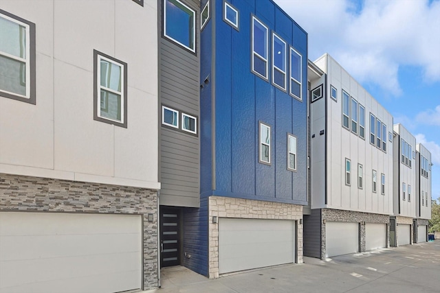 2235 Lovedale Ave Unit 102, Dallas, TX 75235 - view of property featuring an attached garage and driveway