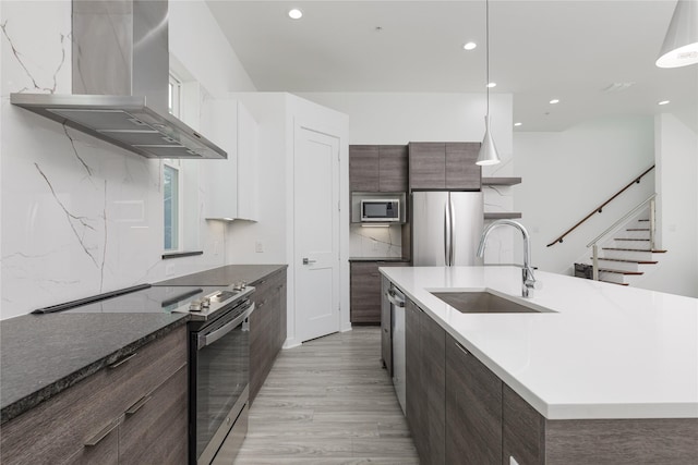 2235 Lovedale Ave Unit 102, Dallas, TX 75235 - kitchen with range hood, appliances with stainless steel finishes, a sink, modern cabinets, and recessed lighting