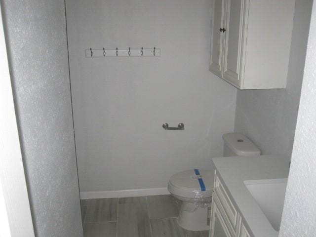 101 Ginger Dr, Pottsboro, TX 75076 - half bath with toilet, vanity, and baseboards