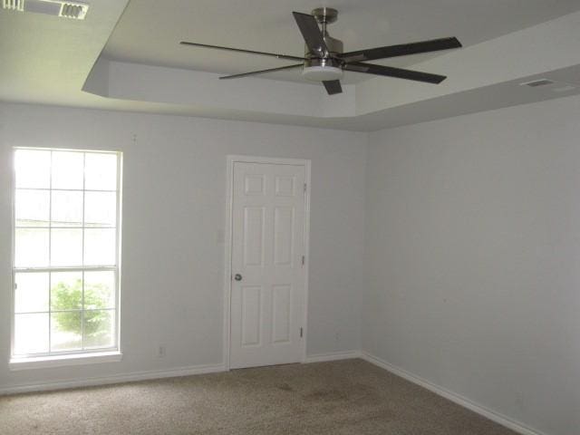 101 Ginger Dr, Pottsboro, TX 75076 - carpeted empty room featuring baseboards, ceiling fan, and a raised ceiling