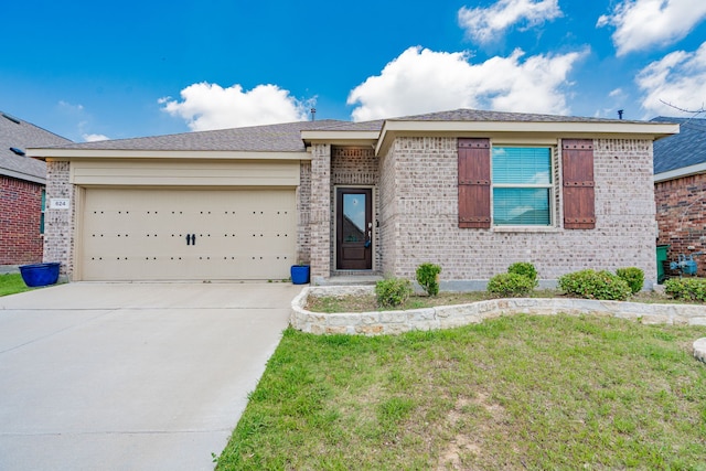 624 Beltrand Ln, Fate, TX 75087 - ranch-style home featuring brick siding, concrete driveway, an attached garage, and a front yard