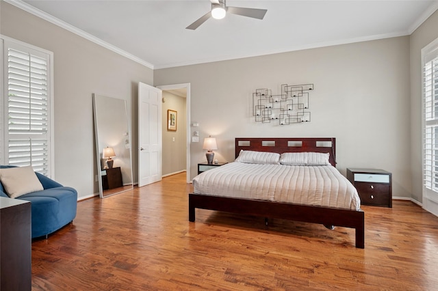 3908 Sagamore Hill Ct, Plano, TX 75025 - bedroom with wood finished floors, crown molding, baseboards, and a ceiling fan