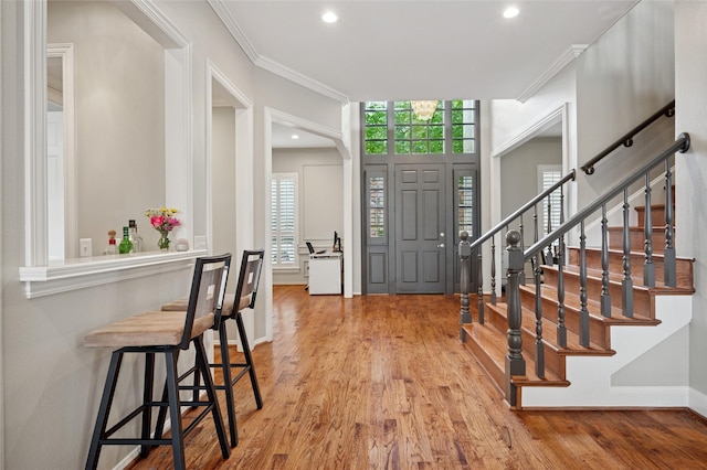3908 Sagamore Hill Ct, Plano, TX 75025 - entrance foyer with wood finished floors, crown molding, recessed lighting, stairway, and baseboards
