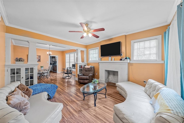 1815 Proctor Ave, Waco, TX 76708 - living area with ornate columns, a brick fireplace, wood finished floors, crown molding, and a ceiling fan