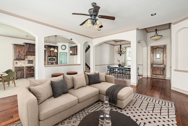 11048 Fernbury Dr, Fort Worth, TX 76179 - living area with dark wood-type flooring, a ceiling fan, crown molding, baseboards, and a chandelier