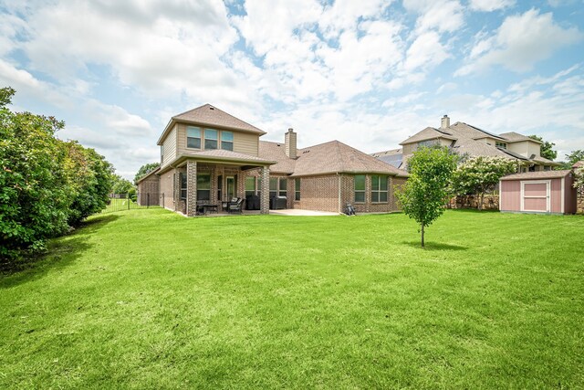11048 Fernbury Dr, Fort Worth, TX 76179 - back of property with a patio, brick siding, and a chimney