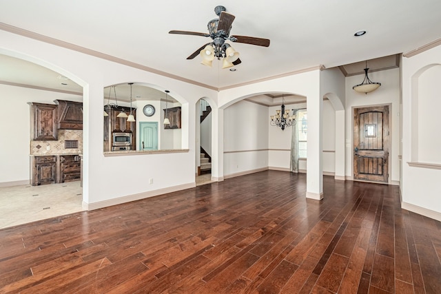 11048 Fernbury Dr, Fort Worth, TX 76179 - unfurnished living room with ceiling fan, ornamental molding, dark wood finished floors, baseboards, and a chandelier