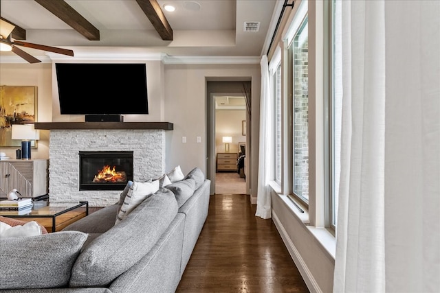 3480 Newport Dr, Prosper, TX 75078 - living room featuring a ceiling fan, beamed ceiling, a fireplace, dark wood-style flooring, and baseboards