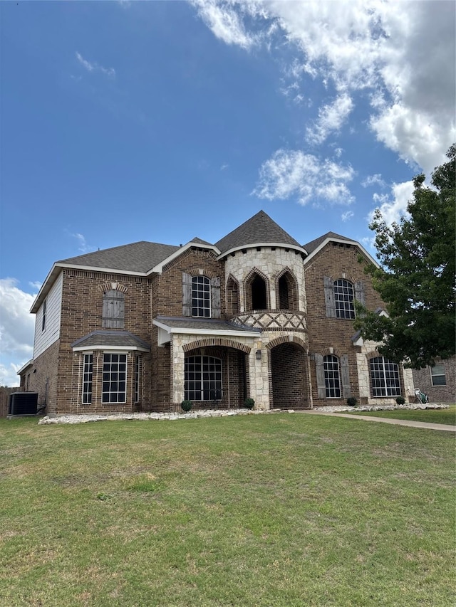 1549 Alamo Bell Way, Fort Worth, TX 76052 - back of house featuring brick siding, a yard, cooling unit, and stone siding