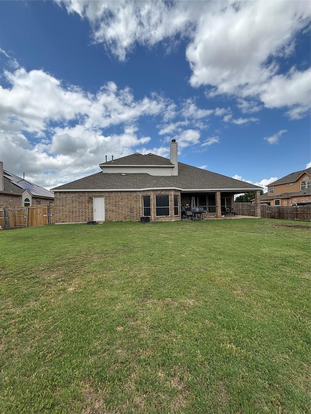 1549 Alamo Bell Way, Fort Worth, TX 76052 - rear view of property featuring a chimney, brick siding, and roof with shingles