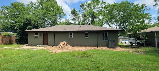 4017 Pickett St, Greenville, TX 75401 - back of property featuring central AC unit and a yard